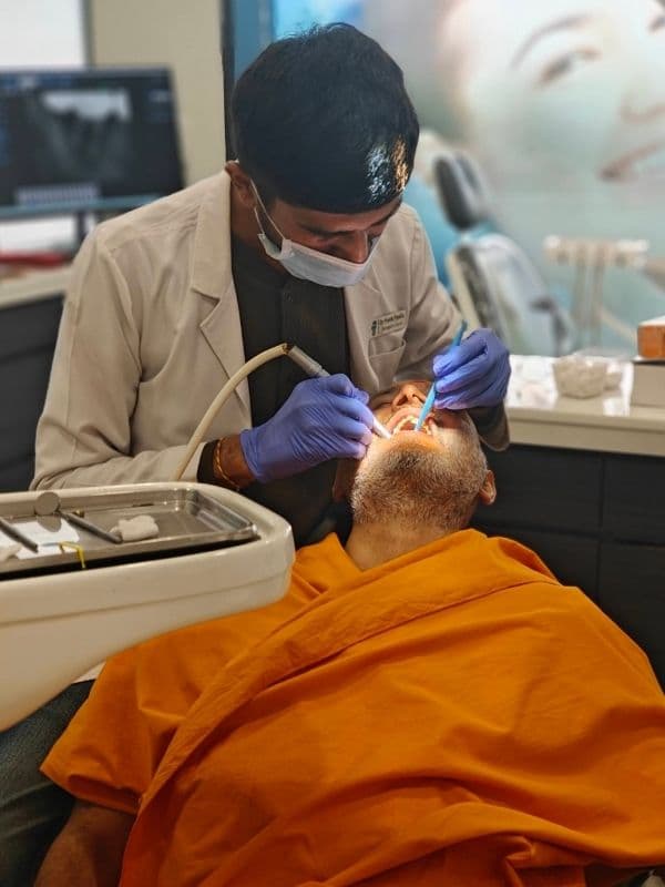 Dr. Pratik Pipalia performing chairside dental implant treatment in Rajkot, Gujarat