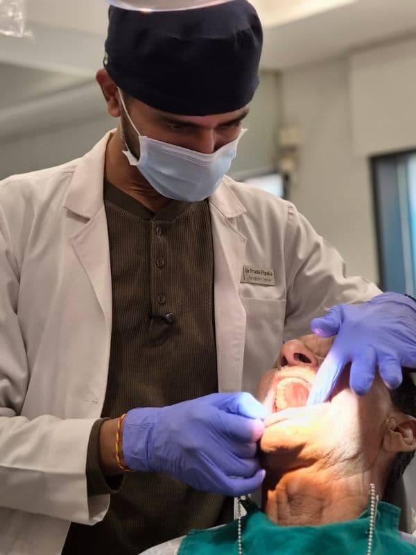Dr. Pratik Pipalia focused on precision dental implant care at his Rajkot clinic